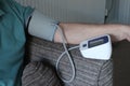 Adult arm and blood pressure machine in the home .record reading for doctors Royalty Free Stock Photo