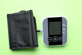 Blood pressure measuring device on green background, top view Royalty Free Stock Photo