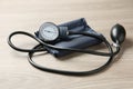 Blood pressure measuring device on wooden table Royalty Free Stock Photo