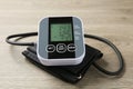 Blood pressure measuring device on wooden table, closeup Royalty Free Stock Photo