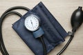 Blood pressure measuring device on wooden table, top view Royalty Free Stock Photo