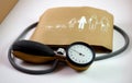 Blood pressure meter, or sphygmometer, with the band in which they are imprinted the instructions for use Royalty Free Stock Photo