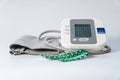 Blood pressure monitor to take blood pressure and pills to lower it,