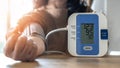 Blood pressure monitoring with digital sphygmomanometer for patient with hypertension or high blood pressure illness by self-check Royalty Free Stock Photo