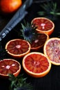 Blood red orange slices,on a dark background