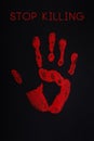 Red palm print on black background with an inscription Stop Killing All Lives Matter