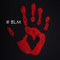 Red palm print on black background with heart and inscription Black Lives Matter