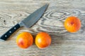 Blood Sicilian oranges on wooden cutting board with knife. ripe juicy citrus fruits on rustic background. Top view