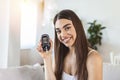 Blood sugar testing at home. Checking Blood Sugar Level At Home. Diabetic Checking Blood Sugar Levels. Woman checking blood sugar Royalty Free Stock Photo