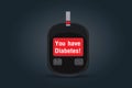 Blood test machine have message `You have Diabetes` on screen. Royalty Free Stock Photo