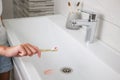 Blood on toothbrush on background of sink. Selective focus on the toothbrush Royalty Free Stock Photo