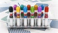 Blood vials with vibrant colored lids standing on medical forms. 3D illustration Royalty Free Stock Photo