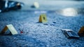 Bloodied Glasses, Bloody Knife and Empty Wallet, all Marked as Clues in a Murder Investigation Royalty Free Stock Photo