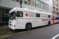Bloodmobile partked on the street.