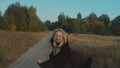 Bloodthirsty vampire frightening on dirt road in dark