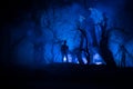 bloodthirsty zombies attacking. hungry zombies in the woods. Silhouettes of scary zombies walking in the forest at night Royalty Free Stock Photo