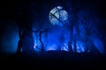 bloodthirsty zombies attacking. hungry zombies in the woods. Silhouettes of scary zombies walking in the forest at night Royalty Free Stock Photo