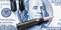 The bloody business of war. Bullets on dollar bills as symbol of