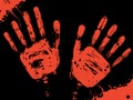 Bloody handprints with stains of blood on a black background. Royalty Free Stock Photo