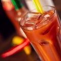 Bloody marry drink on wooden table close up