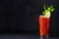 Bloody Mary cocktail on black background. Royalty Free Stock Photo