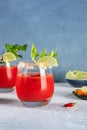 Bloody Mary cocktail with celery and lime, with a red hot pepper Royalty Free Stock Photo