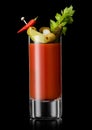 Bloody mary cocktail with hot red and green pepper and celery on black background Royalty Free Stock Photo