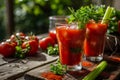 Bloody Mary cocktail with ice cubes, celery sticks and parsley leaves Royalty Free Stock Photo