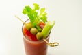 Bloody Mary cocktail prepared with pure vodka, tomato juice and hot pepper sauce, drink decorated with three olives and celery Royalty Free Stock Photo