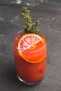 Bloody oranges beverage with thyme