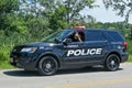Bloomfield Police Driving Down Road Waving Royalty Free Stock Photo