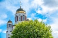 Blooming apple tree against the background of the Orthodox Church and the blue sky. Temple-on Blood, Yekaterinburg, Russia Royalty Free Stock Photo