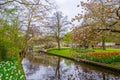 A blooming apple tree near the river in Keukenhof park, Lisse, Holland, Netherlands Royalty Free Stock Photo