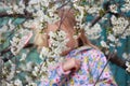 Cherry blossom tree, and the silhouette of a little girl is out of focus Royalty Free Stock Photo