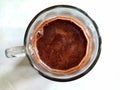 Blooming coffee on a glass cup isolated on a white background. Top view