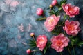 Blooming Elegance: Pink Peonies on Textured Blue Surface. Concept Floral Arrangements, Pink