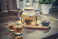 Blooming flowering tea in glass teapot Royalty Free Stock Photo