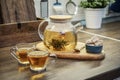 Blooming flowering tea in glass teapot Royalty Free Stock Photo