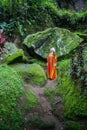 Blooming gorgeous lady in a dress of flowers in the rainforest Royalty Free Stock Photo