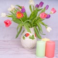 Blooming tulips, candles, Easter eggs, Happy Easter concept, Happy Easter
