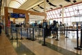 People going through TSA security screening a busy international airport