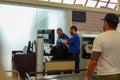 Two TSA Security employees checking a backpack for potentially dangerous items Royalty Free Stock Photo