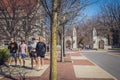 Bloomington USA - Four university students in shorts walk away from University of Indiana campus down sidewalk -1 on Royalty Free Stock Photo