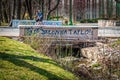 Bloomington USA Two University students with a basketball cross concrete bridge with Breonna Taylor spray painted on it Royalty Free Stock Photo