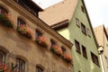 Blossoming geranium on the windows and balconies