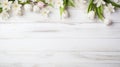 blossoming spring flowers on white rustic wooden texture table top view with copy space