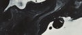 Blotted black ink patterns create organic forms against a blank white background