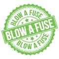 BLOW A FUSE text on green round stamp sign