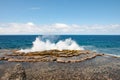 Blow Holes in Tonga, water splashing out rocks on shore of South Pacific Ocean