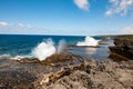 Blow Holes in Tonga, water spouting out rocks on shore of South Pacific Ocean Royalty Free Stock Photo